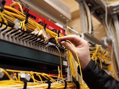The,Technician,Attaching,Fiber,Optic,On,The,Telecom,Site